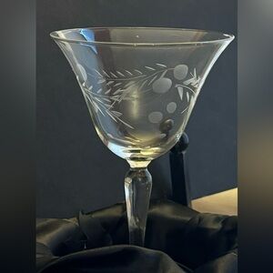Set of four etched wine glasses